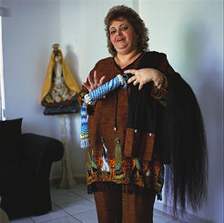 Ibis García with horsetail for Yemojá in her home, Miami. Photograph by Carl Juste.