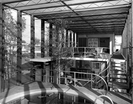 Igor Polevitzky’s Birdcage House on Biscayne Island was a radical experiment in outdoor living. It is the clearest example of his concept of the house as a volume of screened space, rather than solid mass. The split-level design consists of a series of floating concrete decks, with openness to each other and the outdoors. The screened cage encloses a pool and tree, while the exterior landscaping features a lagoon and sandy beach. In its entirety, the house is a utopian indoor-outdoor environment, an ideal famously explored by Buckminster Fuller in his Skybreak House.