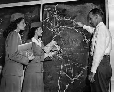 Pan Am instructor David Gossett shows flight attendants Phyllis Parsons and Jewel McWilliams the airline’s South American routes. 1946. Miami News Collection, HistoryMiami. 1989-011-209.