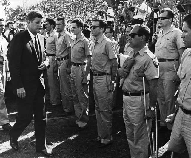 President Kennedy reviews the veterans. Visible in the background are some of the thousands of Cuban exiles that attended the event. December 29, 1962. Charles Trainor, photographer. Miami News Collection, HistoryMiami. 1989-011-21739.