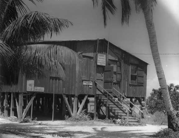 Chokoloskee, a small island, was first settled in 1874. Its most famous resident, Ted Smallwood, settled there in 1897, and ran a store for decades. A causeway finally connected it to Everglades City and civilization in 1955. This view: Smallwood Store, 1960s.
