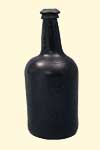 Wine bottle. Ca. 1755. 23.8 x 9.8 cm. Institute of Jamaica, 1997/0924. Glass bottles in this squat cylindrical shape became common during the mid-18th century.