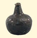Glass wine bottle. Ca. 1680-1730. 15.4 x 13.9 cm. Institute of Jamaica, 1997/0335. The onion shape is the oldest type of glass bottle found in Port Royal.