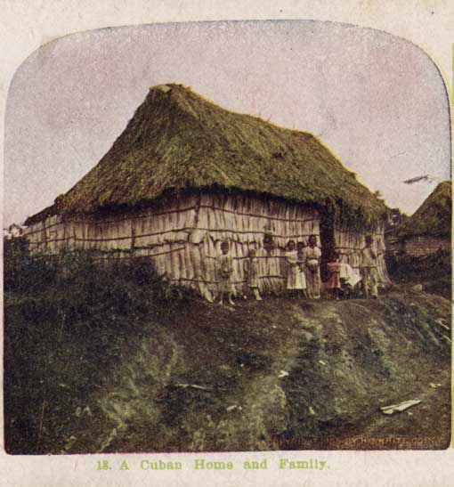 A Cuban home and family. New York : H.C. White, 1905. Image number x-1865-1 Shows a family standing before a bohio (a thatched hut).
