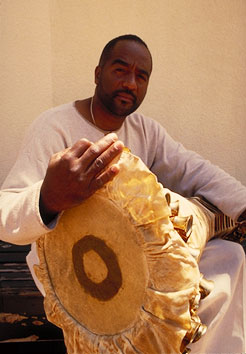 Ezequiel Torres with batá drum at the Historical Museum of Southern Florida.