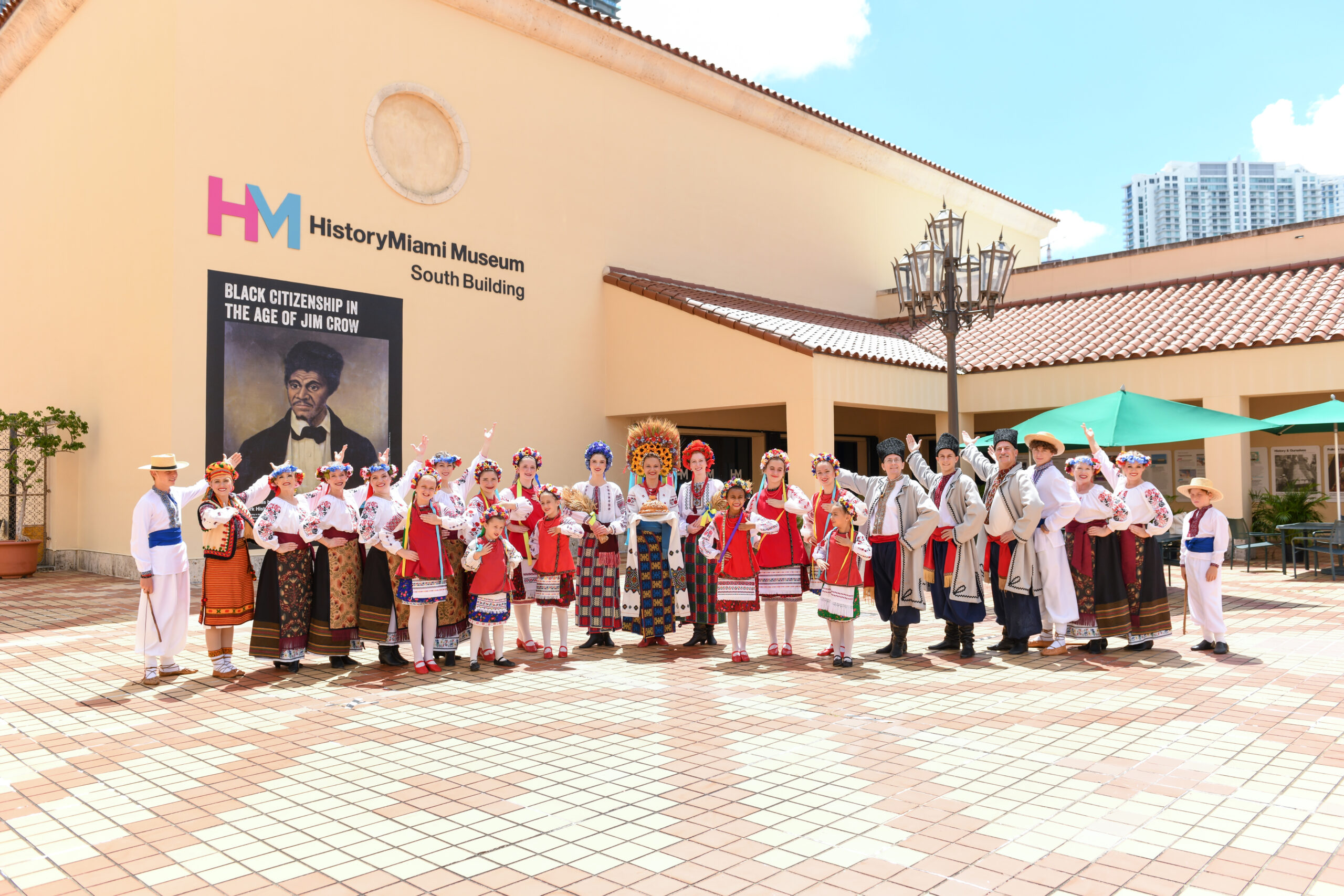 The Ukrainian Dancers of Miami pose in front of the HistoryMiami Museum building.