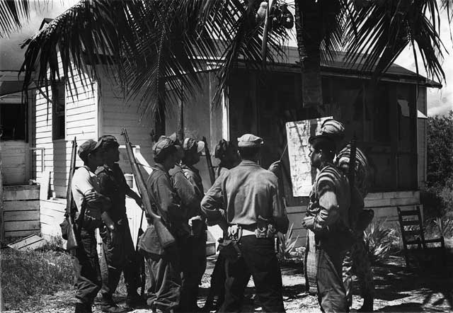 Trainees gather for lessons on tactics of jungle fighting. October 10, 1962. Richard Agnew photographer. Miami News Collection, HistoryMiami. 1989-011-4601.