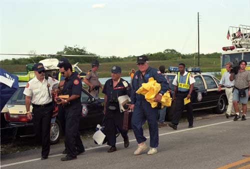 Emergency personnel on the scene of the ValuJet flight 592 crash in the Everglades. May 11, 1996. Photo by Howard Zinn. Miami Herald Collection, HistoryMiami. MH 64037-15.