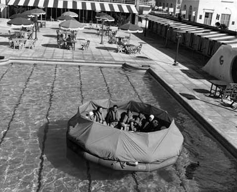 All in-flight personnel received training in procedures for emergency landings in water. Procedures included evacuating the plane, inflating the raft, boarding it and waiting for rescue. During the 1950s, Pan Am used the pool of the Robert Clay Hotel in downtown Miami for its training, while Eastern used the Miami Springs Villas. Pan Am crew in covered raft. 1950s. HistoryMiami, gift of Jackie Snyder. 2010-331-36.
