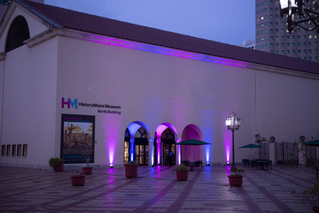 HistoryMiami North building in the evening with up lights highlighting the entrance
