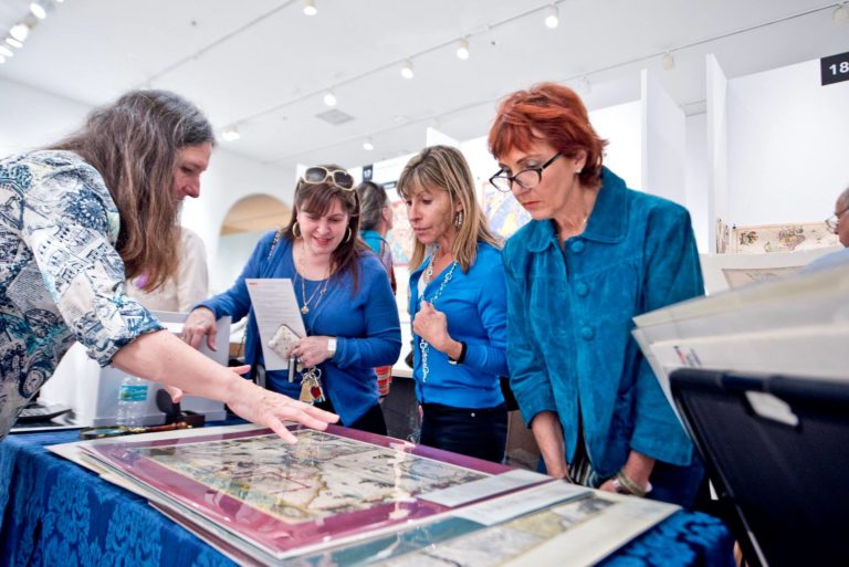 women looking at old map