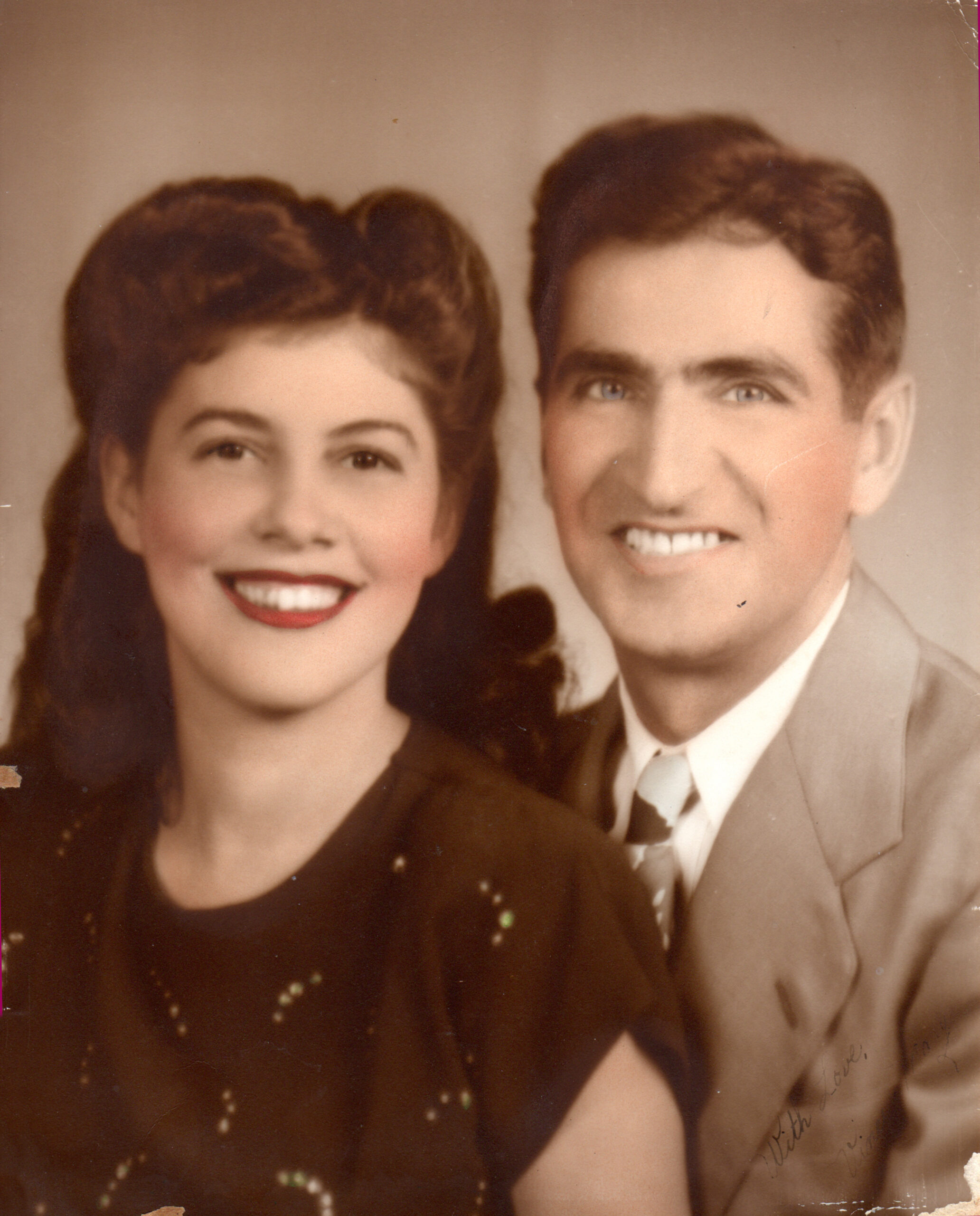 Mary Merlo and Vincent Biondi smile and pose for a professional closeup photo in 1947.