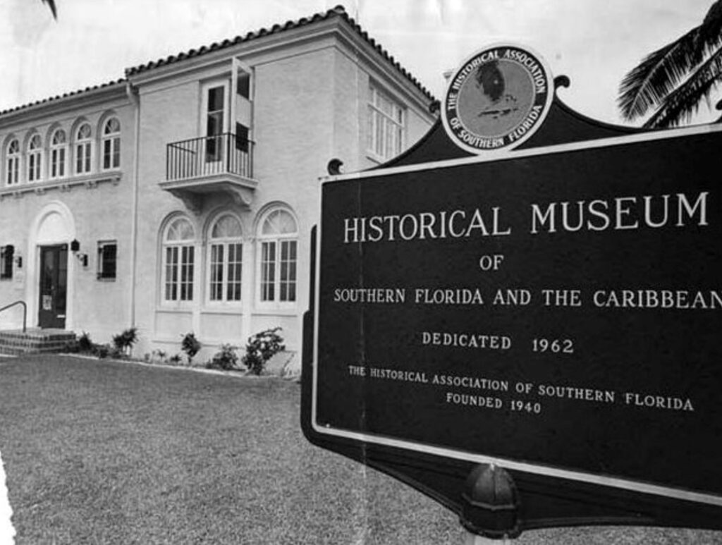 Historical photo of the building with the sign that reads Historical Museum of Southern Florida and the Caribbean dedicated 1962. The Historical Association of Southern Florida founded 1940