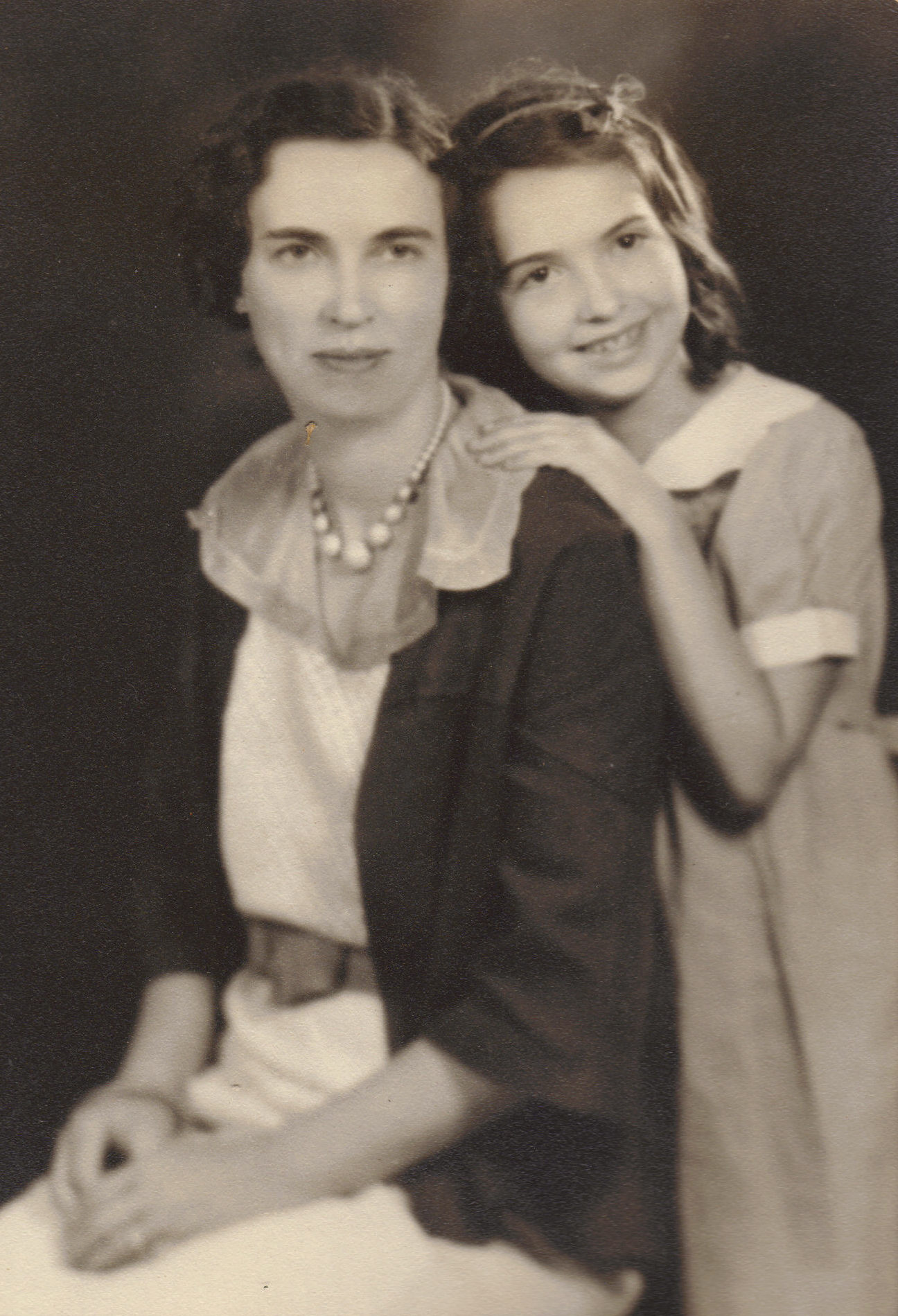 A black and white photo of a seated woman, Lyla Haynes and her daughter Joan who is standing behind her with an arm on her shoulder.