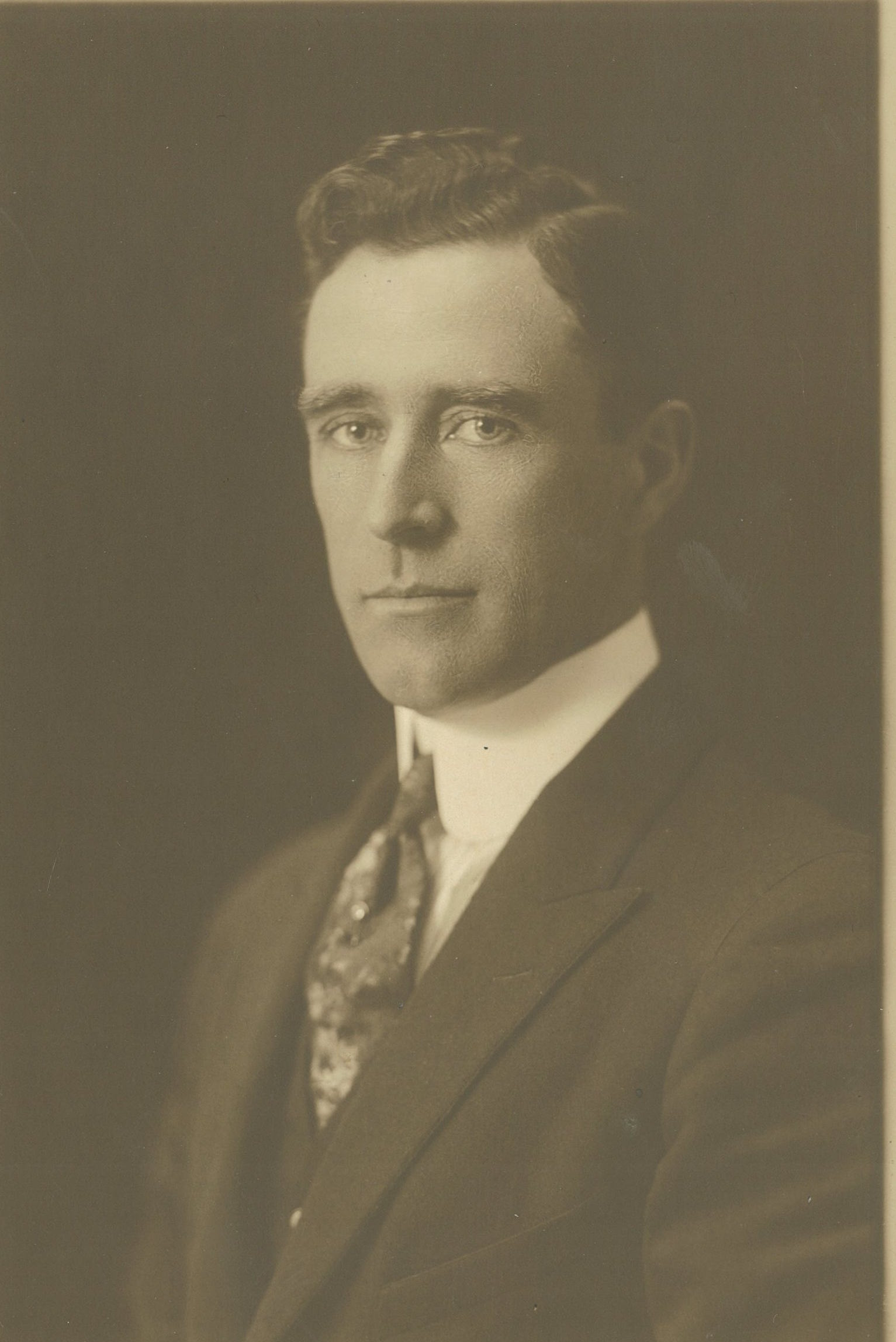 Black and white headshot of a man in a suit, James Edward Sheehan