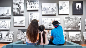 Children looking at images on the wall.