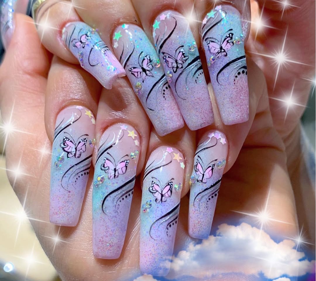 A purple, blue, and pink nail design with pink butterflies and wispy freestyle lines