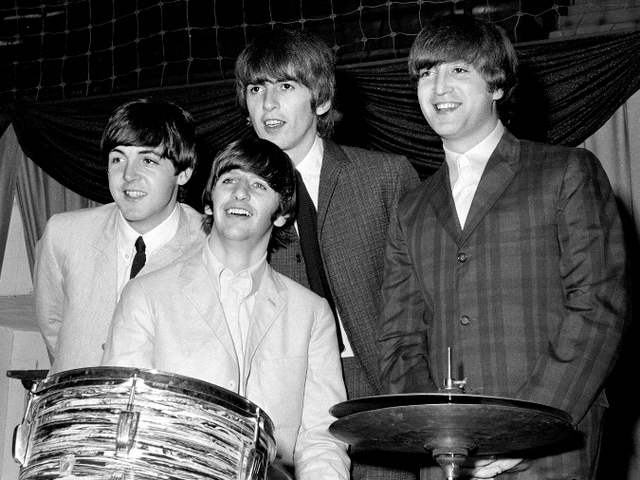 a photo of the famous rock band the Beatles who are four white men