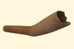 Red clay smoking pipe. 17th century. 9.4 x 2.1 cm. Institute of Jamaica, 2006.1.73 (R). Red clay pipes are found almost exclusively in Jamaica, where they were made by African potters. This pipe has lost most of its stem.