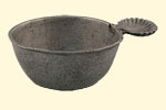 Pewter porringer. 17th century. 4.9 x 15.2 cm. Institute of Jamaica, 1998/0542. Porringers were used to eat soup or porridge. The handle for this one is in the shape of a seashell.