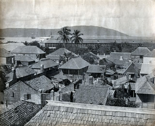 J.B. Valentine & Sons. Photograph of Port Royal. 1891. 24 x 29 cm. National Library of Jamaica, Port Royal 7070. Note the densely built wood and brick houses and the Naval Hospital in the background. J.B. Valentine & Sons was a prominent photographic firm in Scotland.