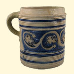 German stoneware cup (Westerwald). 17th century. 15.7 x 17.0 cm. Institute of Jamaica, 2006.1.97 (R). Greyish stoneware from the Westerwald region of Germany was often decorated with blue floral patterns.
