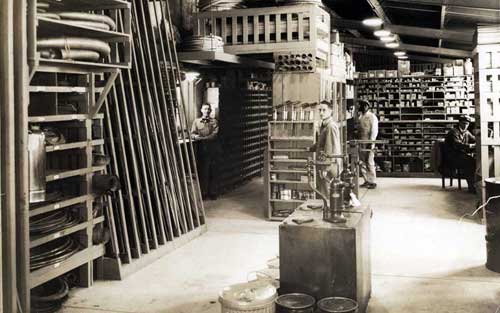 Pan Am terminal shop stockroom was located in a low-ceilinged lean-to hangar, making it easy to access by mechanics. Circa 1935. HistoryMiami. X-491-117.